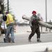 A construction worker walks with heavy materials on the East Stadium bridge Nov. 13, 2012. Daniel Brenner I AnnArbor.com
